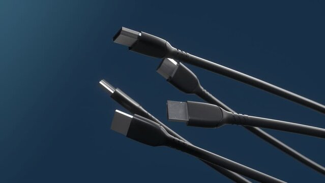 HDMI cables spinning on dark blue background. Close-up view of the plug in high definition. HDMI connectors for computer video. Multimedia interface. Equipment.