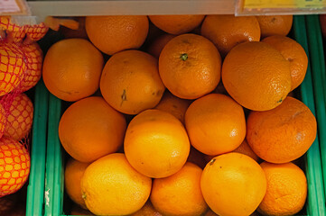 A crate of oranges at the market..