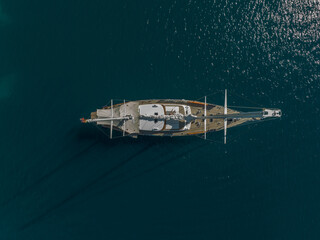 Drone topdown shot of a yacht, sailing boat