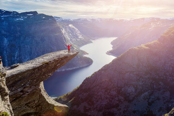 Woman standing on Trolltunga in Norway  - 648315067