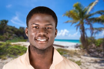 Happy young man posing outdoors