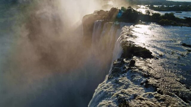 Wide, Drone Shot of Victoria Falls At Sunset