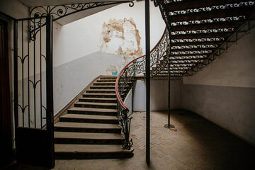 Vintage forged cast iron spiral staircase at the old mansion