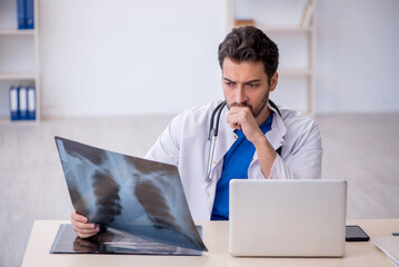 Young male doctor radiologist working in the clinic