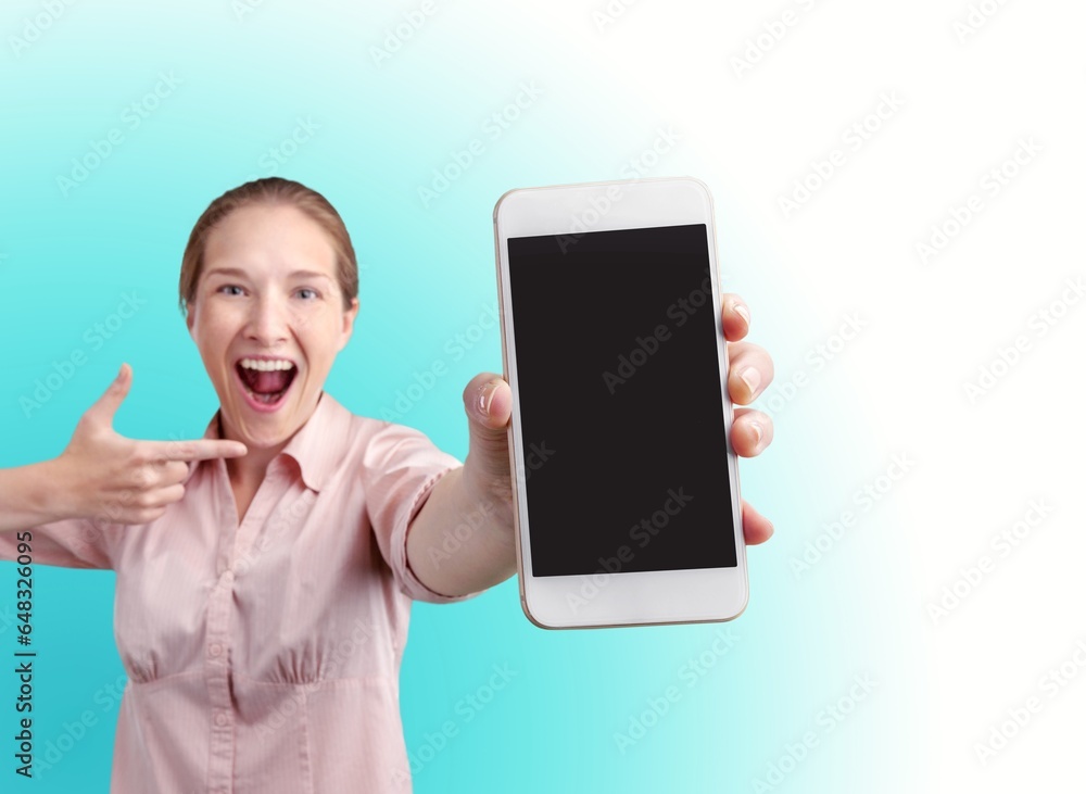 Poster Beautiful young woman holding blank screen smartphone