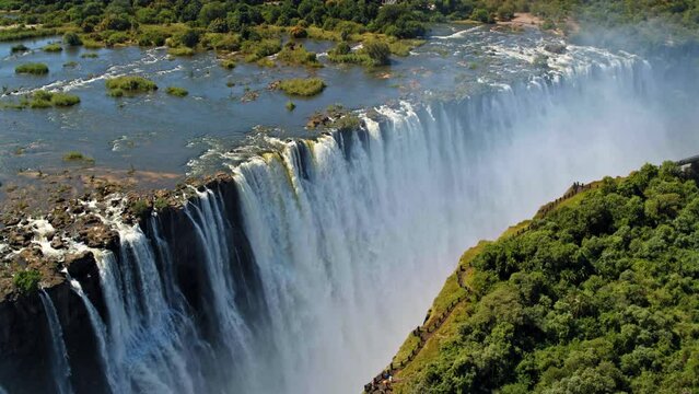Zambia falls aerial drone panning down falls in midday