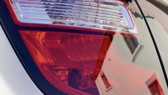 Close-up Macro Shot of a Car Rear Red and White Headlight