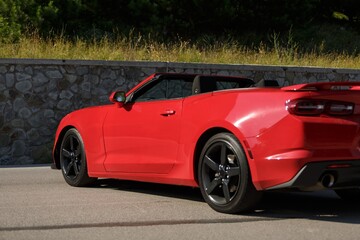 New red cabriolet on mount background