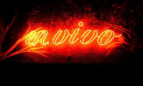 live neon letters on brick wall - Powered by Adobe