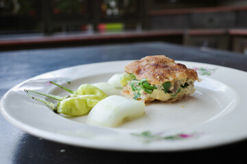 martabak served with chilies and pickles