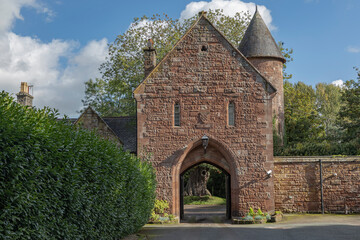 Fototapeta na wymiar Arched castle entrance with open gates