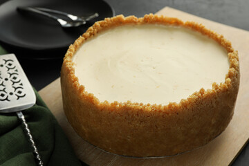 Tasty vegan tofu cheesecake served on dark table