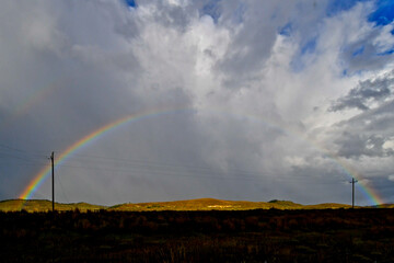Full rainbow, with all its meanings; new beginning, inclusivity, good luck, Devine encouragement,...