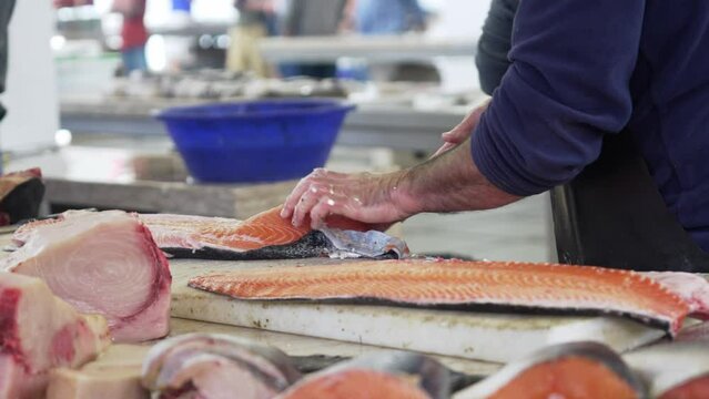 Footage of busy fish stals at Farmers Market in Funchal city