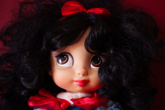 doll face with voluminous black hair