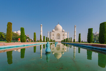 Architecture of the Taj Mahal as seen from the fountain. The Taj Mahal is an architectural masterpiece and one of the most iconic landmarks in the world.