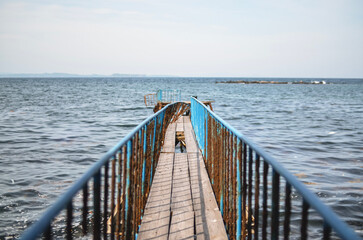 Naklejka premium The deserted iron road leads to the sea