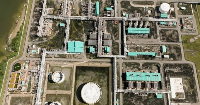 Aerial view of oil and gas terminal with storage tanks for petroleum products. Borneo, Sabah, Malaysia.