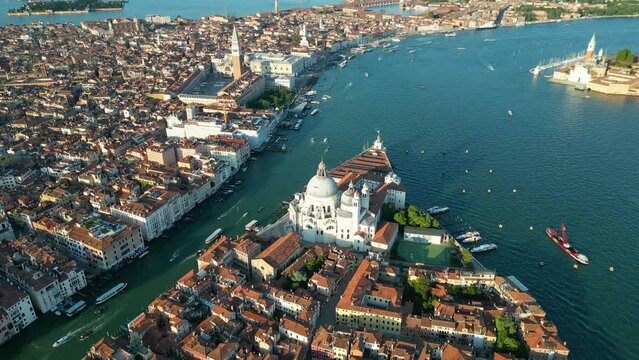 Venice city skyline, aerial view of Basilica Saint Mary of Health and Grand Canal, triangular shape architecture, Venetian Lagoon, Italy