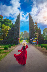 Young female tourist at the temple gate, Bali, Indonesia © munduuk