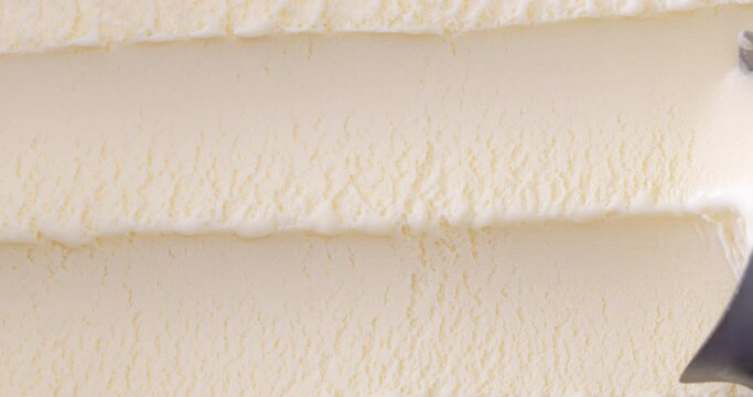 4K footage Close-up Top view,  Scoop out vanilla flavored ice cream view from above.