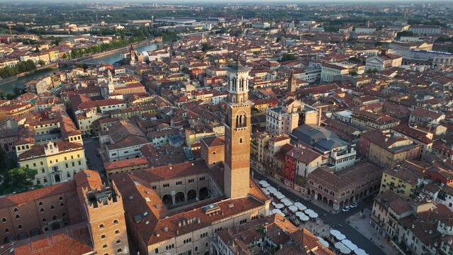 Verona urban skyline, Establishing Aerial View Shot of Piazza delle Erbe, Torre dei Lamberti, historical city centre, urban skyline, Cathedral, Veneto Region, Italy