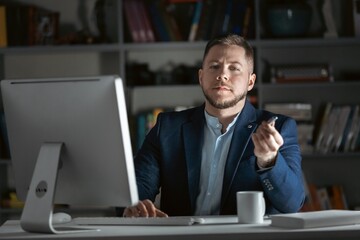 Man in dark office working on pc