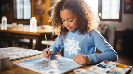 Foto op Canvas A little girl draws and makes things on the theme of winter at school © jr-art