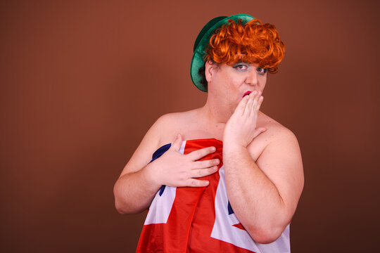 Beauty and lifestyle. Funny fat man posing in a make-up. Brown background.
