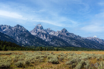A stunning view of a beautiful mountain range, located at Grand Teton National Park in Northwest...