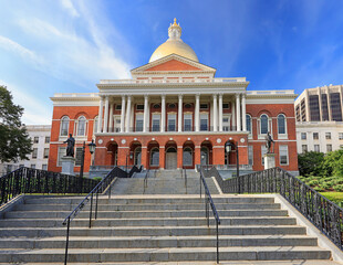 Massachusetts State House and State Library. Imposing red building with white columns and golden dome. 