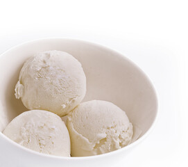 Fototapeta na wymiar Balls of tasty vanilla ice cream in bowl