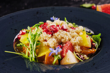 salad couscous with grapefruit and pomegranate seeds