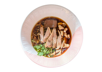 Top view of Duck noodle on a pink bowl on white isolated, focus selective