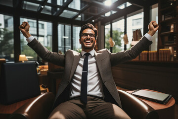 Fototapeta na wymiar Successful businessman raised hand, smiling and celebrate some achievement
