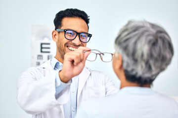Glasses, optometrist and client with appointment, vision and consultation with diagnosis, smile and...