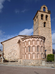 Fototapeta na wymiar Church of San Vicente. View of the mudejar apse (13th century) and the bell tower. Village of Zarzuela del Monte. Segovia. Spain.
