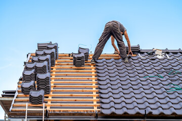 ceramic roof covering, construction of a new roof of a family house - obrazy, fototapety, plakaty