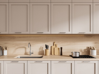 Wooden kitchen interior with beige cabinets
