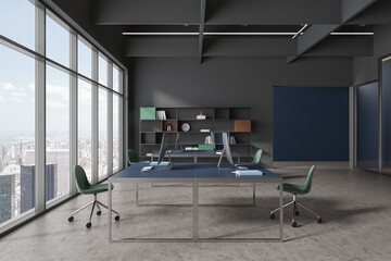 Dark blue and gray open space office with bookshelves