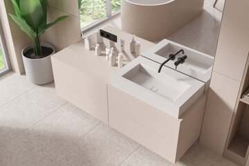 Top view of beige home bathroom interior with sink and mirror, accessories - obrazy, fototapety, plakaty