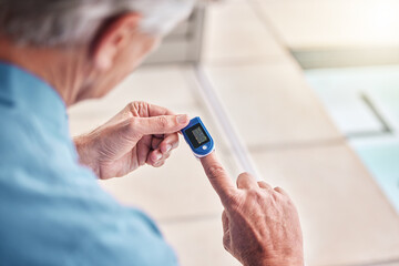 Closeup, digital oximeter and elderly hands measure oxygen saturation, pulse or heart health....