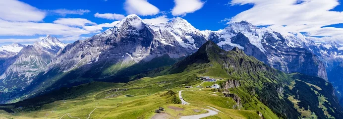 Wandcirkels plexiglas Swiss nature scenery. Scenic snowy Alps mountains Beauty in nature. Switzerland landscape. View of Mannlichen mountain and famous hiking route "Royal road" © Freesurf