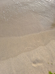 Soft beautiful ocean wave on sandy beach. Background