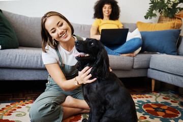 Pet, relax or happy woman with dog in house living room on floor to hug with trust, loyalty or love. Wellness, freedom or girl playing with an animal with care, support or kindness on mat at home