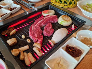 
This is beef grilling on a grill.