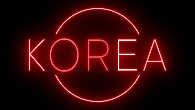 Flickering red retro style neon sign glowing against a black background