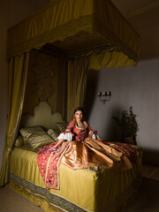 Renaissance woman on bed © Anneke