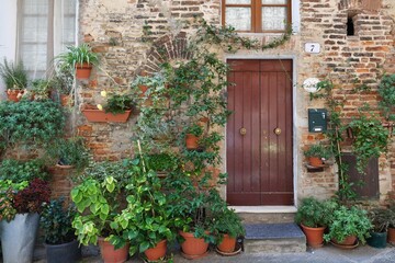The facade of an old house in Città della Pieve, a medieval village in Umbria, Italy.