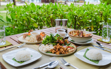 Romantic dinner on the beach in Koh Kood Thailand, dinner table with Asian food with fish and crab and lobster with curry